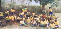 Students gather for a meal at Mwisi Primary School in Peter Mutabazi’s home village of Kabale, in southwestern Uganda. Mutabazi helps raise money for the school. (Photo courtesy of Peter Mutabazi)