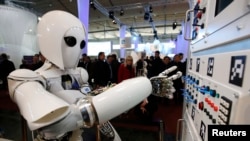 The humanoid robot AILA operates a switchboard during a demonstration by the German research centre for artificial intelligence, Hanover, Germany, March, 5, 2013.