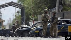 NATO-led Resolute Support forces inspect the site of a car bomb explosion in Kabul, Afghanistan, Sept. 5, 2019.