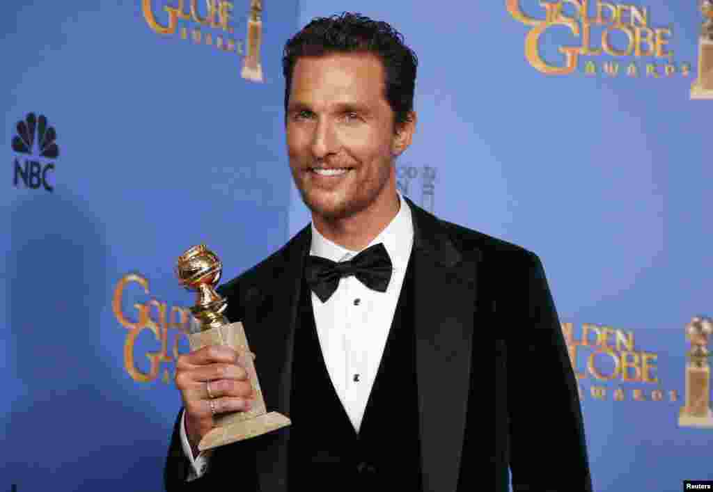 Matthew McConaughey poses with his award for Best Actor in a Motion Picture, Drama for his role in &quot;Dallas Buyers Club&quot; at the Golden Globe Awards in Beverly Hills, California, Jan. 12, 2014. 