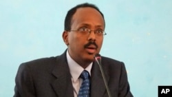 FILE - Then-Somali Prime Minister Mohamed Abdullahi Farmajo addresses officials after his swearing in ceremony at the Presidential residence in Mogadishu, Somalia. 