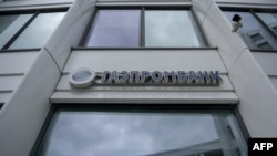 FILE - The logo of Russia's Gazprombank, a subsidiary of state energy giant Gazprom, is seen at its office in Moscow, April 27, 2022. 
