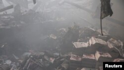 ទិដ្ឋភាព​នៃ​ការ​បំផ្លិចបំផ្លាញ​និង​មនុស្ស​ស្លាប់​ដោយសារ​ការ​វាយប្រហារ​ដោយ​មីស៊ីល​របស់​រុស្ស៊ី លើ​អាជីវកម្ម​បោះពុម្ព​មួយ​កន្លែង​ ក្នុង​តំបន់ Kharkiv ប្រទេស​អ៊ុយក្រែន នាថ្ងៃទី២៣ ខែឧសភា ឆ្នាំ២០២៤។ 