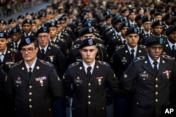 FILE - Military personnel march in the annual Veteran's Day parade in New York, Friday, Nov. 11, 2016. (AP Photo/Andres Kudacki)