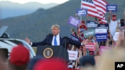 President Donald Trump speaks at a campaign rally at Carson City Airport, Sunday, Oct. 18, 2020, in Carson City, Nev. (AP Photo/Lance Iversen)