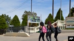 Students from Albuquerque High School walk through Martineztown, one of Albuquerque's oldest and most historic neighborhoods, April 11, 2018. The ACLU of New Mexico is seeking to extend protections to students against discrimination.