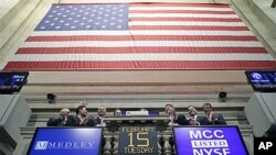 Executives with Medley Capital Corporation attend the opening bell at the New York Stock Exchange, February 15, 2011