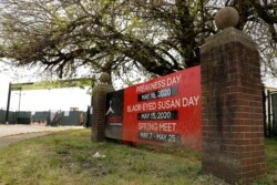 A marquee near an entrance at Pimlico Race Course displays horse races that have been postponed because of the coronavirus outbreak, Friday, May 15, 2020, in Baltimore. The Preakness would have been run Saturday, May 16, 2020, in Baltimore but is delayed