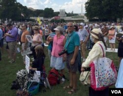 FILE - Supporters listen to presidential candidate Donald Trump speak against the Iran nuclear deal at the US Capital, Wednesday, Sept. 9, 2015.