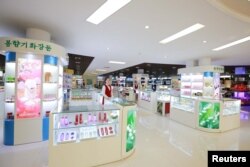 FILE PHOTO: Employees are seen during a field guidance visit by North Korean leader Kim Jong Un at the newly built Mirae Shop and Health Complex in this undated photo released by North Korea's Korean Central News Agency (KCNA) on March 28, 2016.