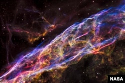 FILE - NASA's Hubble Space Telescope unveiled in stunning detail a small section of the expanding remains of a massive star that exploded about 8,000 years ago.