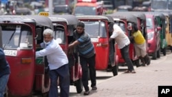 FILE- Sri Lankan drivers line up to buy fuel near a fuel station in Colombo, Sri Lanka on April 13, 2022. (AP Photo/Eranga Jayawardena, File)