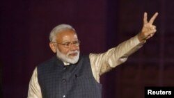 FILE - Indian Prime Minister Narendra Modi gestures toward his supporters after the election results at Bharatiya Janata Party (BJP) headquarter in New Delhi, India, May 23, 2019.