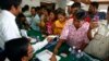 Supporters of National Rescue Party gather to give their thumbprint as they complain that their names were not in the voting lists in July 28 election, July 31, 2013.