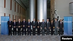 Trade ministers from a dozen Pacific nations in Trans-Pacific Partnership Ministers meeting post in TPP Ministers "Family Photo" in Atlanta, Georgia, October 1, 2015.