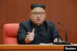 FILE - Kim Jong Un speaks during the Second Plenum of the 7th Central Committee of the Workers' Party of Korea (WPK) at the Kumsusan Palace of the Sun, in this undated photo released by North Korea's Korean Central News Agency (KCNA) in Pyongyang, Oct. 8, 2017.