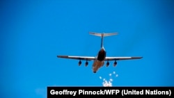 A World Food Program airdrop over South Sudan in December 2011.
