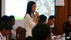 Phyo Phyo Aung, a representative of student protesters, speaks during a meeting with representatives of the Myanmar government and the National Network for Education Reform in Yangon, Feb. 11, 2015.
