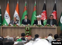 Afghan President Ashraf Ghani (2nd R), Pakistani Prime Minister Shahid Khaqan Abbasi (R), Turkmen President Kurbanguly Berdymukhamedov (2nd L) and India's Minister of State for External Affairs M.J. Akbar (L) attend the inauguration ceremony of TAPI pipeline construction work, in Herat, Afghanistan, Feb. 23, 2018.