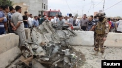 Kirkuk shahrida yuz bergan portlashdan keyingi manzara, Iroq, 8-may, 2013-yil.