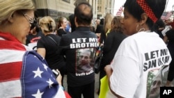 FILE - Iraqis and supporters rally outside the Theodore Levin United States Courthouse in Detroit, June 21, 2017.