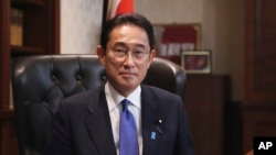 Japan’s former Foreign Minister Fumio Kishida poses for a portrait picture following his press conference at the headquarters of the Liberal Democratic Party after he was elected as party president in Tokyo Wednesday, Sept. 29, 2021. (Du Xiaoyi/Pool Photo via AP)