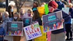 FILE - Students who attend Salt Lake City School District schools rally at East High School Monday, Dec. 7, 2020, in Salt Lake City, urging the school board and administrators to resume in-person learning. (AP Photo/Rick Bowmer)