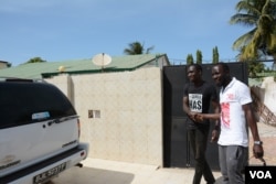 A friend of Tijan Barrow, left, wears one of Barrow's more popular t-shirts.