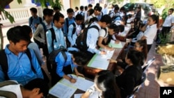 Students register to participate in a campaign by the National Election Committee, NEC, in Phnom Penh, Cambodia, Wednesday, May 9, 2018.