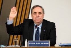 Former Scottish leader Alex Salmond is sworn in before giving evidence to a committee of the Scottish parliament at Holyrood in Edinburgh, Feb. 26, 2021.
