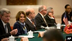 U.S. House Minority Leader Nancy Pelosi of Calif., second from left, smiles during a bilateral meeting with Zhang Ping, vice chairman of China's National People's Congress, at the Great Hall of the People in Beijing, Nov. 12, 2015.