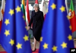 British Prime Minister Theresa May arrives for an EU summit at the Europa building in Brussels, Dec. 14, 2017.