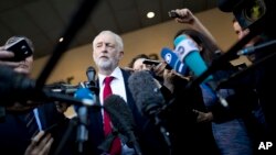 FILE - British Labor party leader Jeremy Corbyn talks to journalists outside the European Commission headquarters in Brussels, Belgium, Sept. 27, 2018.