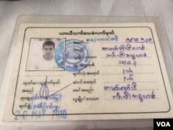 A "White Card" identification document returned to immigration authorities by a Rohingya man. (Colin Lovett/VOA)
