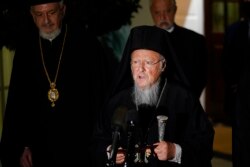 FILE - Ecumenical Patriarch Bartholomew I, the spiritual leader of the world's Orthodox Christians, talks to reporters outside the West Wing of the White House in Washington, Oct. 25, 2021, following his meeting with President Joe Biden.
