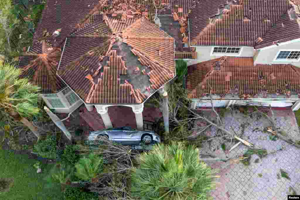 Damage to a home is seen after a tornado ripped through The Preserve development in Wellington as Hurricane Milton tracked across Florida, Oct. 10, 2024. 