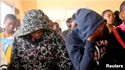 FILE - Schoolchildren who were kidnapped by armed men are pictured after they were released, at a governor's office in Bamenda, Cameroon Nov. 7, 2018. Another nine students and a teacher were freed Wednesday, Nov. 21, 2018.