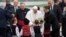 Pope Francis is welcomed by children wearing traditional dresses upon his arrival in Sofia, Bulgaria, May 5, 2019. Pope Francis is visiting Bulgaria, the European Union's poorest country and one that taken a hard line against migrants, a stance that confl