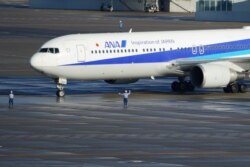 A Japanese chartered plane carrying evacuees from Wuhan, China, landed at Haneda international airport in Tokyo, Jan. 29, 2020.
