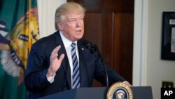 FILE - President Donald Trump speaks at the Treasury Department, April 21, 2017, in Washington.