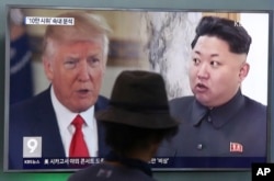 FILE - A man watches a TV screen showing U.S. President Donald Trump, left, and North Korean leader Kim Jong Un during a news program at the Seoul Train Station in Seoul, South Korea, Aug. 10, 2017.