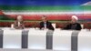 Presidential candidates from left: Saeed Jalili, Iran's top nuclear negotiator, Gholam Ali Haddad Adel, parliament lawmaker, and Hasan Rowhani, former top nuclear negotiator, attend TV debate, Tehran, June 7, 2013.