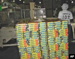 Canned fish being packed for exportation at the Indian Ocean tuna processing plant in Seychelles