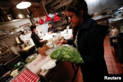 Farmer Nabeela Lakhani delivers vegetables that were grown inside her hydroponic climate controlled farm in Brooklyn, New York, to a client in Manhattan, May 5, 2017.