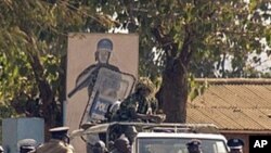 Malawi police patrol on a street of Lilongwe on July 20, 2011