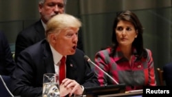 U.S. President Donald Trump speaks as U.N. Ambassador Nikki Haley looks on at the United Nations Global Call to Action on the World Drug Problem during the 73rd U.N. General Assembly in New York, Sept. 24, 2018. 