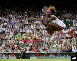 FILE - Serena Williams of the United States reacts after winning against Zheng Jie of China during a third round women's singles match at the All England Lawn Tennis Championships at Wimbledon, England, Saturday, June 30, 2012. (AP Photo/Anja Niedringhaus, File)