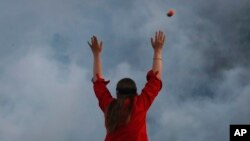 A rubber bullet is fired over a protester by police hidden by a cloud of tear gas in Minneapolis, Minnesota, May 30, 2020.