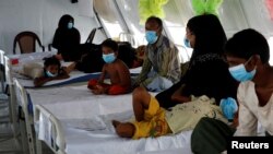FILE - Rohingya refugees, who suffer from diphtheria, are treated at a Medecins Sans Frontieres (MSF) clinic near Cox's Bazar, Bangladesh, Dec. 18, 2017. (REUTERS/Alkis Konstantinidis)
