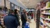 Customers line up to buy food and essential products in a Milan supermarket March 7, 2020, as Italy prepared to quarantine more than 15 million people around Milan and Venice for nearly a month to halt the spread of the new coronavirus.